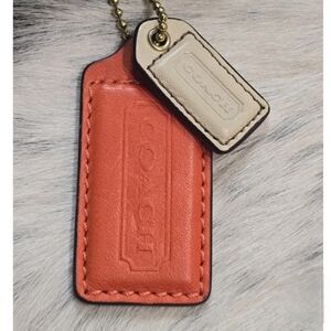 ****SOLD***** Coach Orange And Beige Logo Leather Hangtag